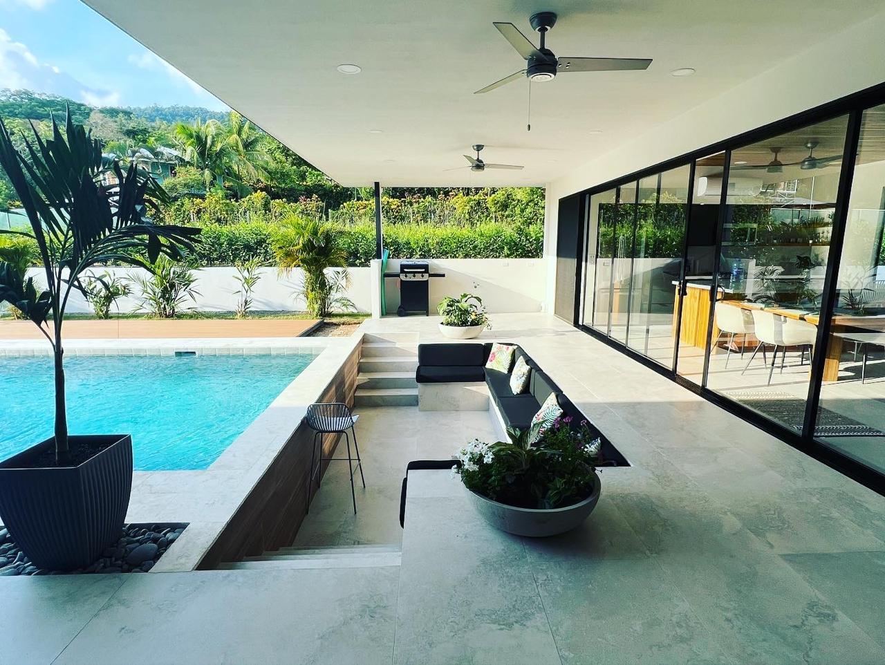 Custom home with pool and glass wall surrounded by jungle near Uvita, Costa Rica