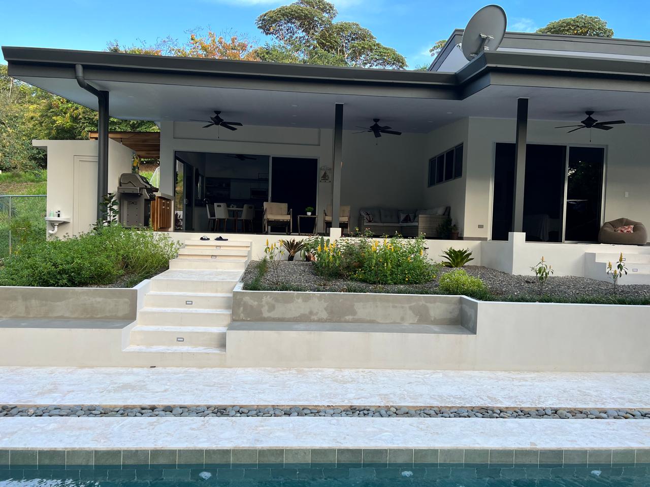 Completed single-level custom home with pool and landscaping in the Costa Ballena