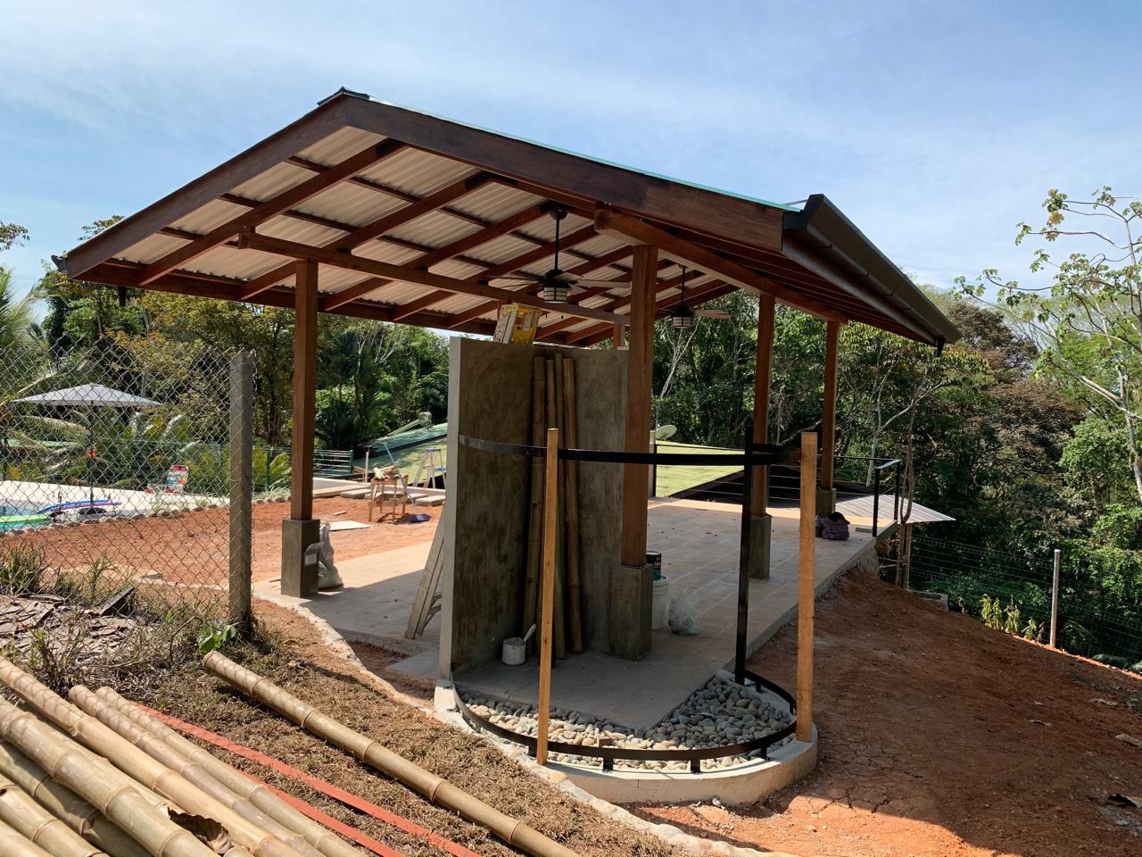 Hardwood roof trusses of an open-air rancho under construction
